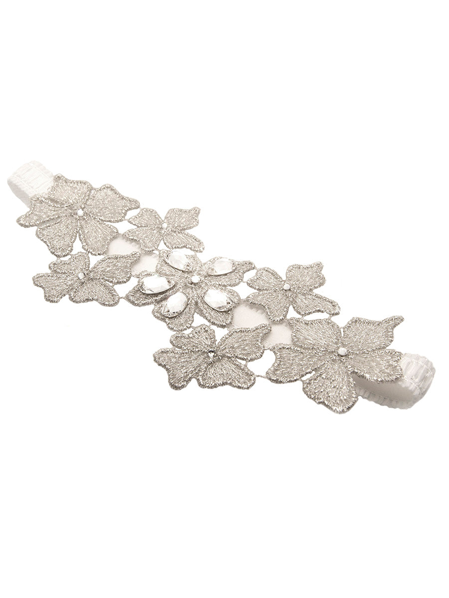 Product shot of the Daya metallic floral garter in silver with Austrian crystals