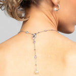 Model wearing the Palmer crystal and pearl lariat necklace in the back