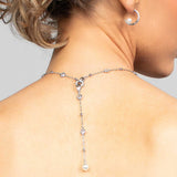 Model wearing the Palmer crystal and pearl lariat necklace in the back