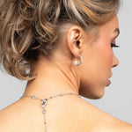 Model wearing the Prim crystal and pearl hoop earring with the Palmer necklace worn in the back