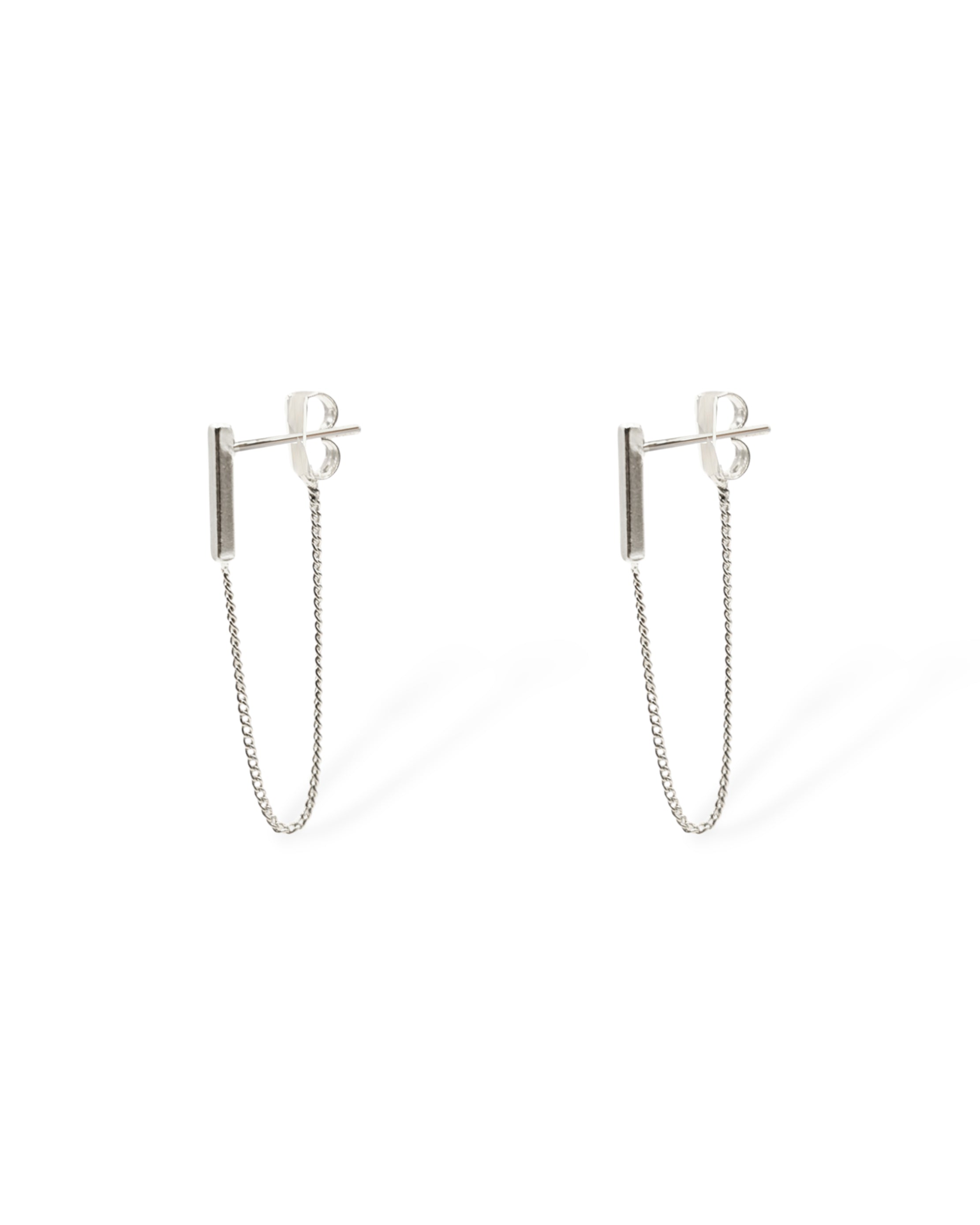Side view of the Sophia earrings in rhodium-plated silver with delicate chain drop.