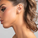 Sophia .0925 sterling silver bar earrings with single chain drop in gold on model.
