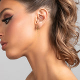 Sophia .0925 sterling silver bar earrings with single chain drop in gold on model.