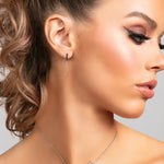 Sophia .925 sterling silver bar earrings with single chain drape on model.