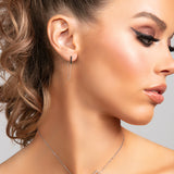 Sophia .925 sterling silver bar earrings with single chain drape on model.