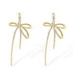 Summer bow earrings in gold with pavé cubic zirconia crystals and long drop design