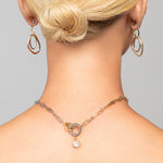 Close-up of Tiffany gold and silver mixed metal choker by Ariel Taub