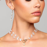 Model wearing Très Chic pearl choker necklace and Tori earrings