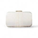 White clutch bag with pearl embellishments on a white background