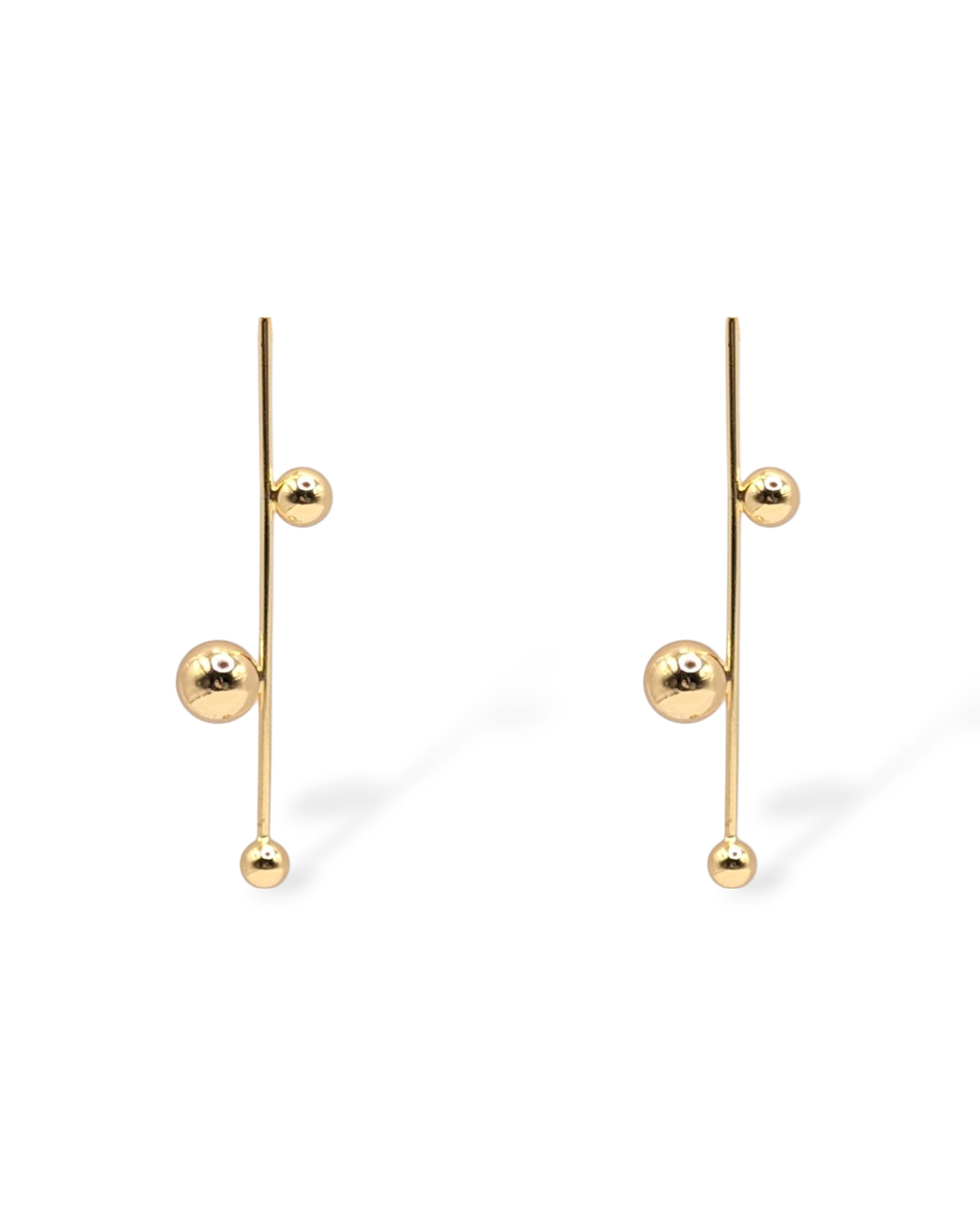 Sawyer drop earrings in gold, featuring a vertical bar with three polished gold spheres in a modern, minimalist design.