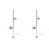Sawyer earrings in silver tone with a slender vertical bar and spherical accents, offering a contemporary drop silhouette.