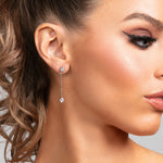 Model wearing Sylvia earrings in silver with CZ crystal drops