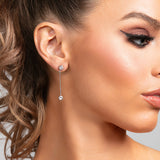 Model wearing Sylvia earrings in silver with CZ crystal drops