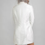 Back view of the Symphony veil with a soft cascade silhouette and sparkling crystals throughout, styled with a modern Andrea Osei BRIDE Renee blazer dress.
