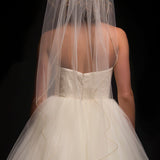 Single tier fingertip length veil with a beaded edge trim.
