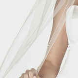 Detail of the serged pencil edge design of this wedding veil.
