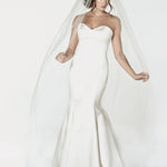 Standard cut chapel length bridal veil with a machine sewn pencil edge design. Available in matte or metallic color trim.