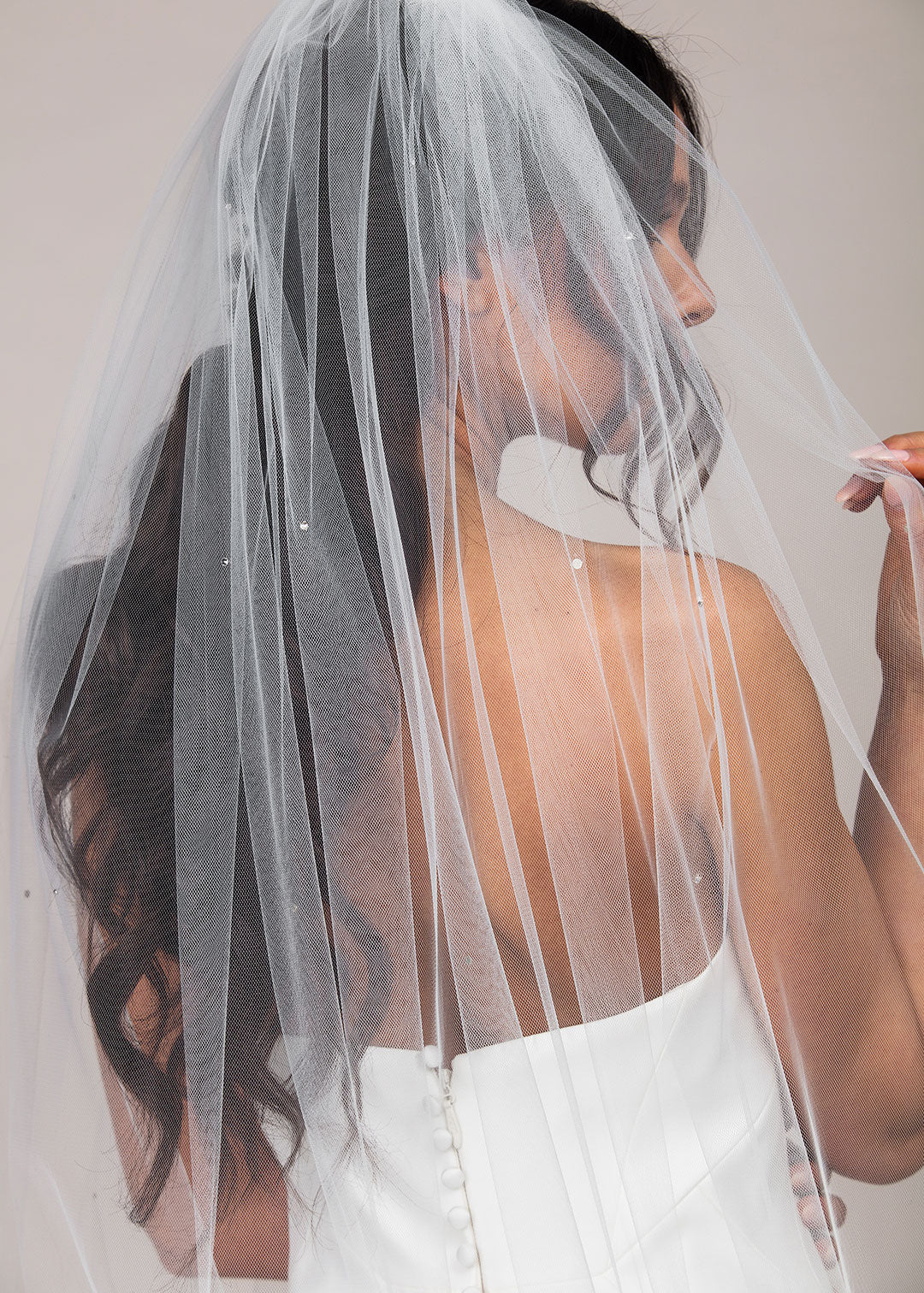 Detail shot of Standard cut cathedral length wedding veil with scattered Austrian crystals throughout.