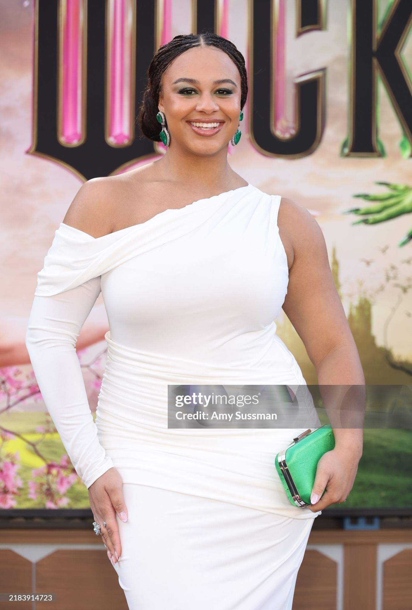 Nia Sioux Rocks Ariel Taub’s Kelly Green Ella Clutch at the Wicked Premiere