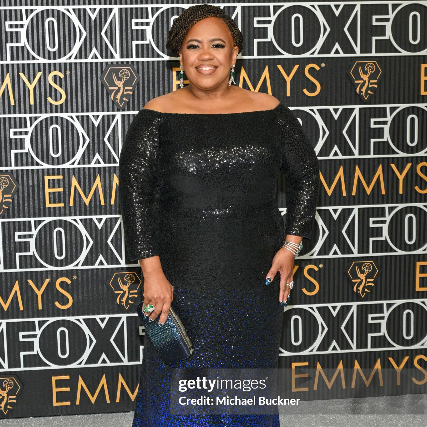 Actress Chandra Wilson wearing an Ariel Taub crystal Ella clutch in Navy with a black to blue ombre sequin gown to the Emmys