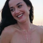Katy Pery wearing the Ariel Taub Palmer necklace in gold at the beach