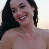 Katy Pery wearing the Ariel Taub Palmer necklace in gold at the beach