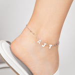 Personalized Opal monogram pearl anklet featuring mother of pearl letters and a delicate heart silver chain, perfect for adding a touch of elegance to bridal, beach, or everyday outfits.