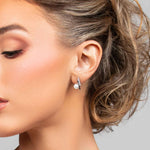 Model wearing the Paxton stud earrings in silver with CZ crystals and pearl
