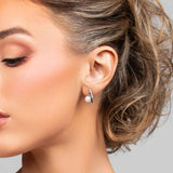 Model wearing the Paxton stud earrings in silver with CZ crystals and pearl