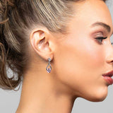 Model wearing the Perry pink cubic zirconia crystal drop earrings in silver