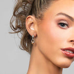 Model wearing the Perry topaz cubic zirconia crystal drop earrings in silver