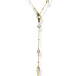 Modern Ricky lariat necklace featuring a gold crystal chain with a detachable spike pendant, perfect for adding understated edge to any outfit.