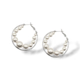 Rhodium-plated large hoops with floating Austrian pearls, designed for modern and versatile wear perfect for everyday fashion or glamorous bridal looks.