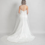 Two tier circular cut cathedral length veil with heavy Austrian pearls at the crown of the head that fade to a light scatter throughout