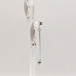 Side view of Stacey silver earrings showing butterfly back crystal drop