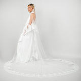 Cathedral-length train of the Tiana veil featuring intricate lace edging