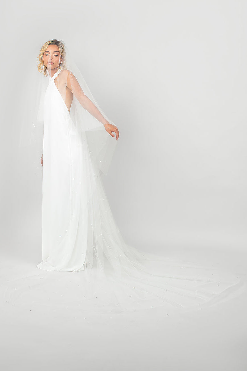 Model wearing the two-tier handkerchief cut Twinkle Veil with double-sided blusher