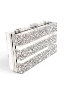Silver glittery clutch bag on a white background