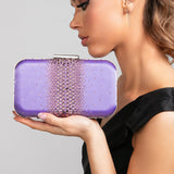 Model in a black dress holding the Ella Crystal Clutch in Lilac, showcasing the ombré crystal design and shimmering purple satin finish.