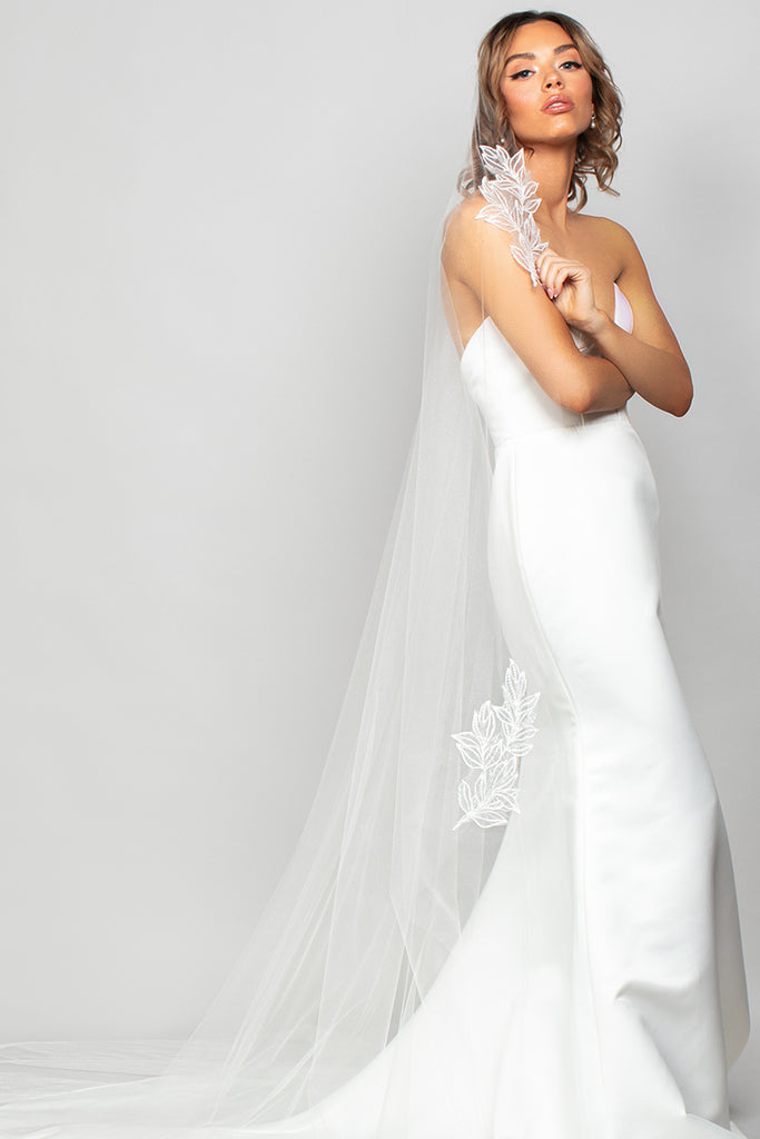 Video of the Sienna veil in motion. A cathedral veil with a seed bead and sequin lace applique placed throughout the veil.