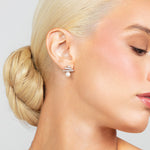 Sterling silver triple bar pave crystal stud earrings with a 6mm pearl at the bottom.