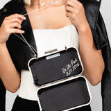 The edge and modern way to personize your wedding day clutch. The Raven clutch is lined in black satin and has the words "do us part" stamped on the inside with an optional to personalize the clutch with your anniversary or wedding date.