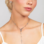 Silver Reed necklace featuring an elegant, modern design with crystal details, paired with Quinn sterling silver triple bar pave crystal post earrings adorned with a 6mm pearl for a sophisticated look.