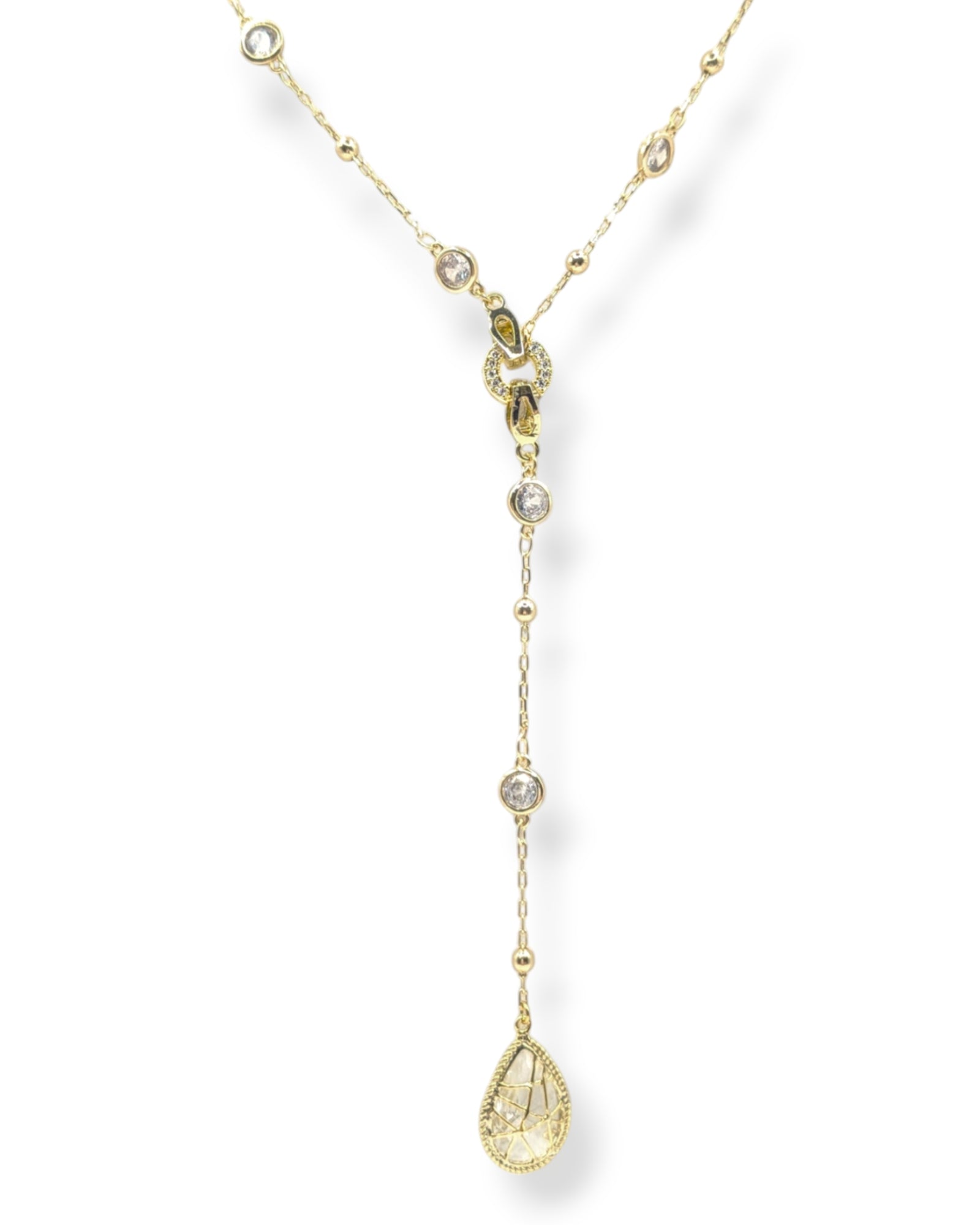 Reed crystal Y-necklace with a detachable teardrop crystal charm allowing it to transition to a choker necklace shown in gold