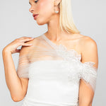 Front detail view of the elegant nylon sparkly tulle wrap with an asymmetrical design and sparkly sequin rose lace applique, adding elegance and modern drama to wedding looks.