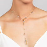 Edgy Ricky crystal spike lariat necklace, perfect for adding a modern edge sparkle to any outfit. Shown in trendy gold.