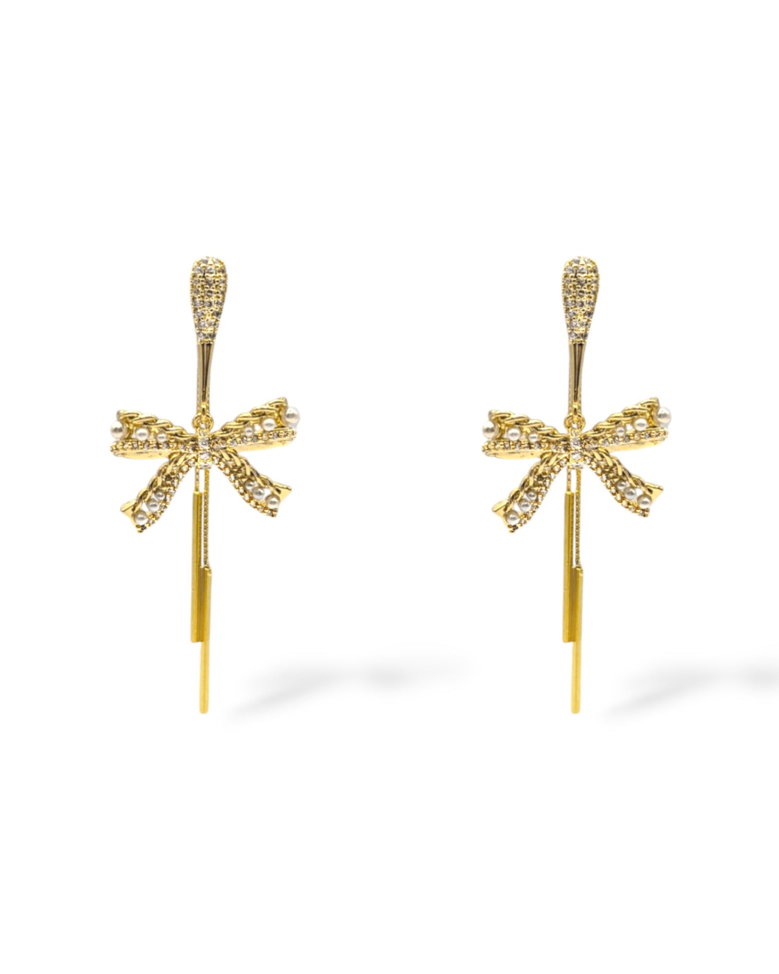 Pave crystal elongated post earrings with a crystal pave rope and pearl bow drop, designed for festive occasions showcased in gold.