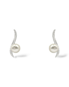 Sterling silver stud earrings with a squiggle pave crystal post and a floating 6mm pearl for modern elegance.