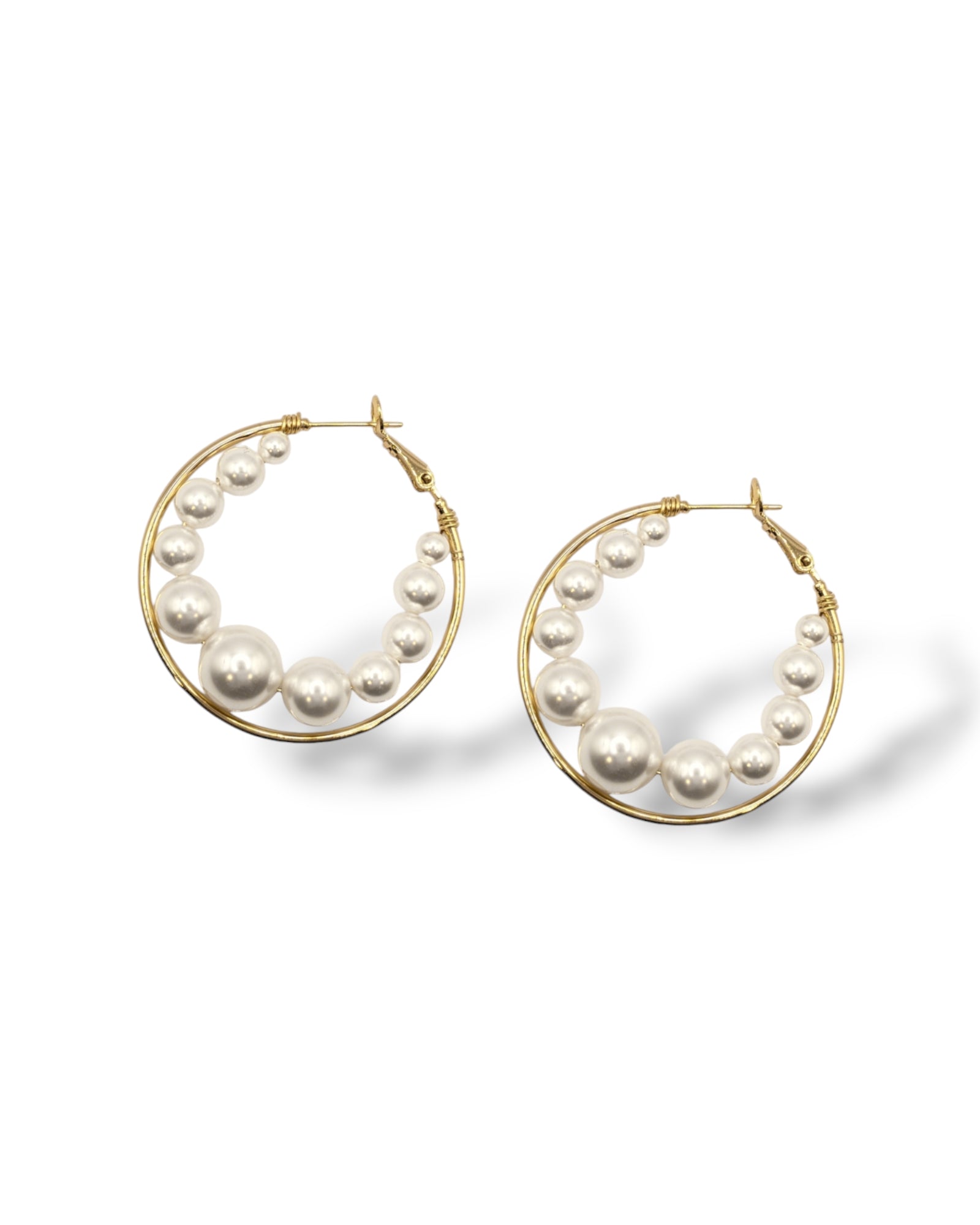 Large 14k gold-plated hoop earrings with Austrian pearls floating elegantly, perfect for versatile, modern styling that transitions from casual to formal occasions.