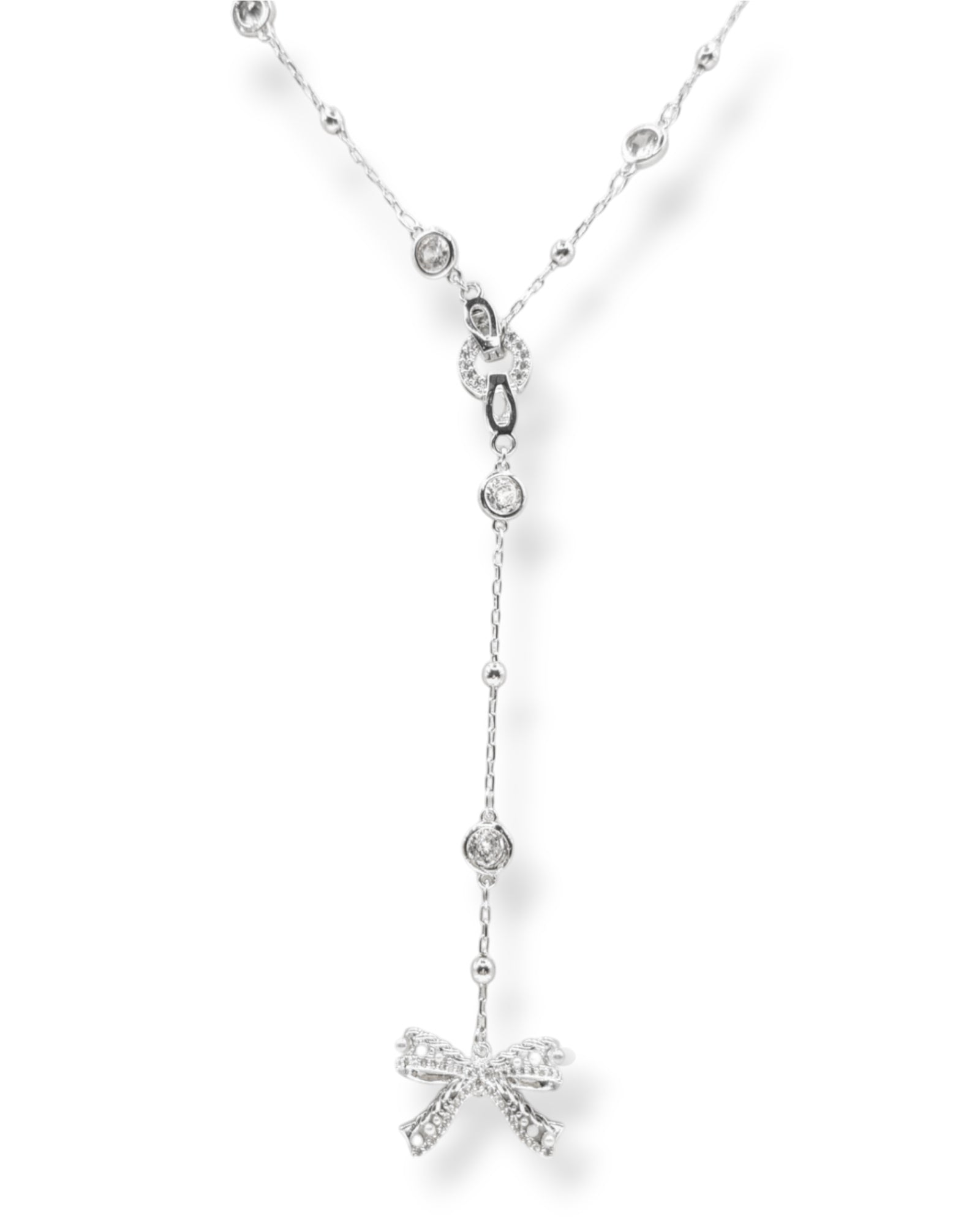 Silver Ryan Y-necklace showcasing its detachable pave crystal bow pendant for a unique and modern bridal or fashion statement.